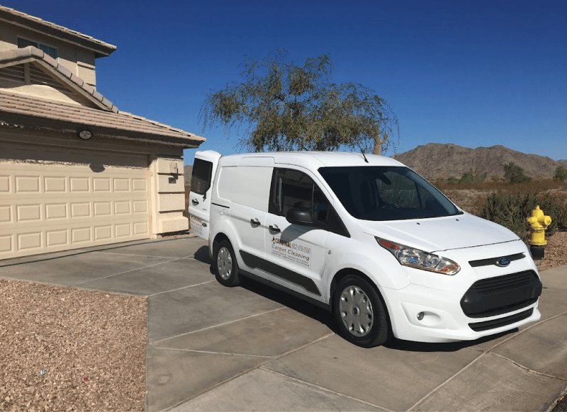 Cardinal Carpet Cleaning Van outside of a house